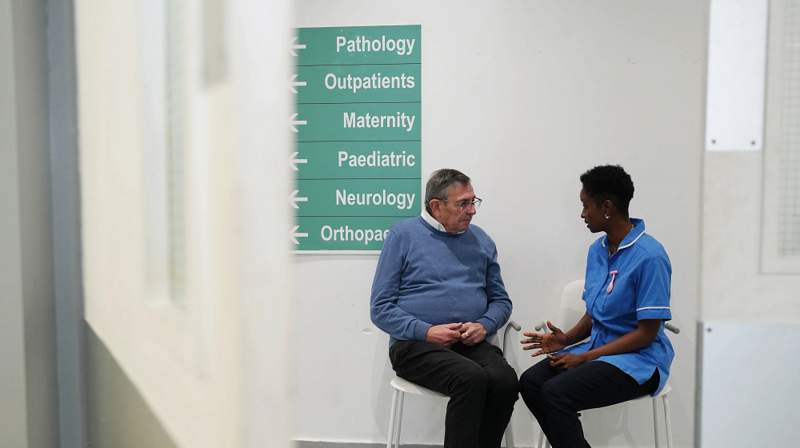 Man And Nurse Talking