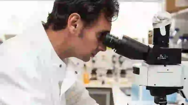 Gerhardt Attard ICR Researcher Using Microscope