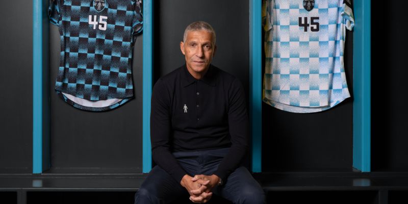 202604 Chris Hughton Infront Of Jerseys