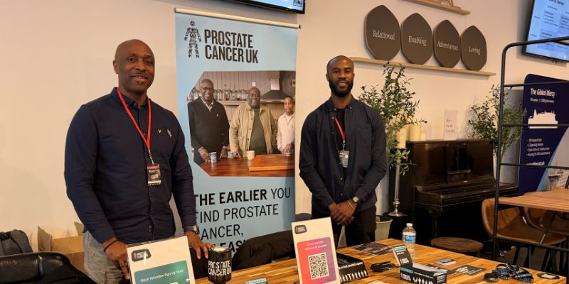 Two members of our Black Health Equity team raising risk awareness at a dedicated Prostate Cancer UK event table.