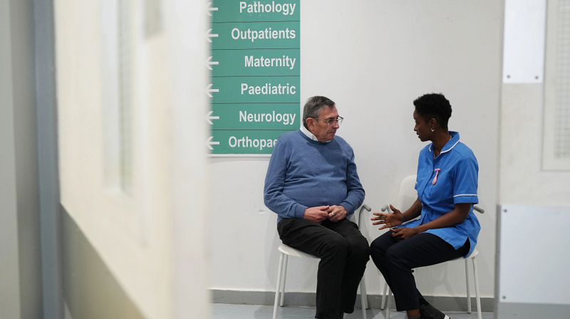 Man And Nurse Talking