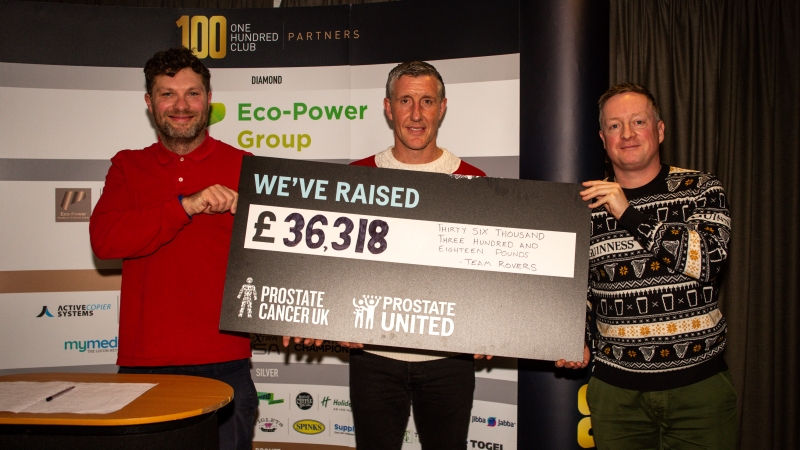 Prostate United men holding cheque.jpg